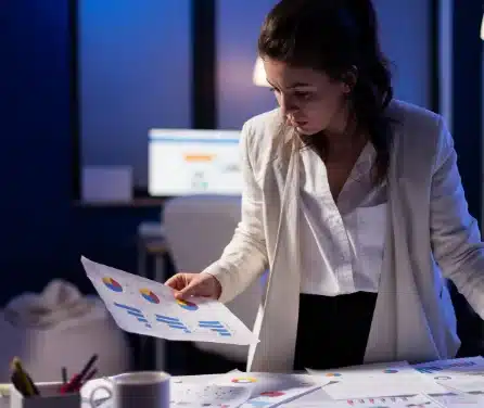 A female sales team member checking documents on her table