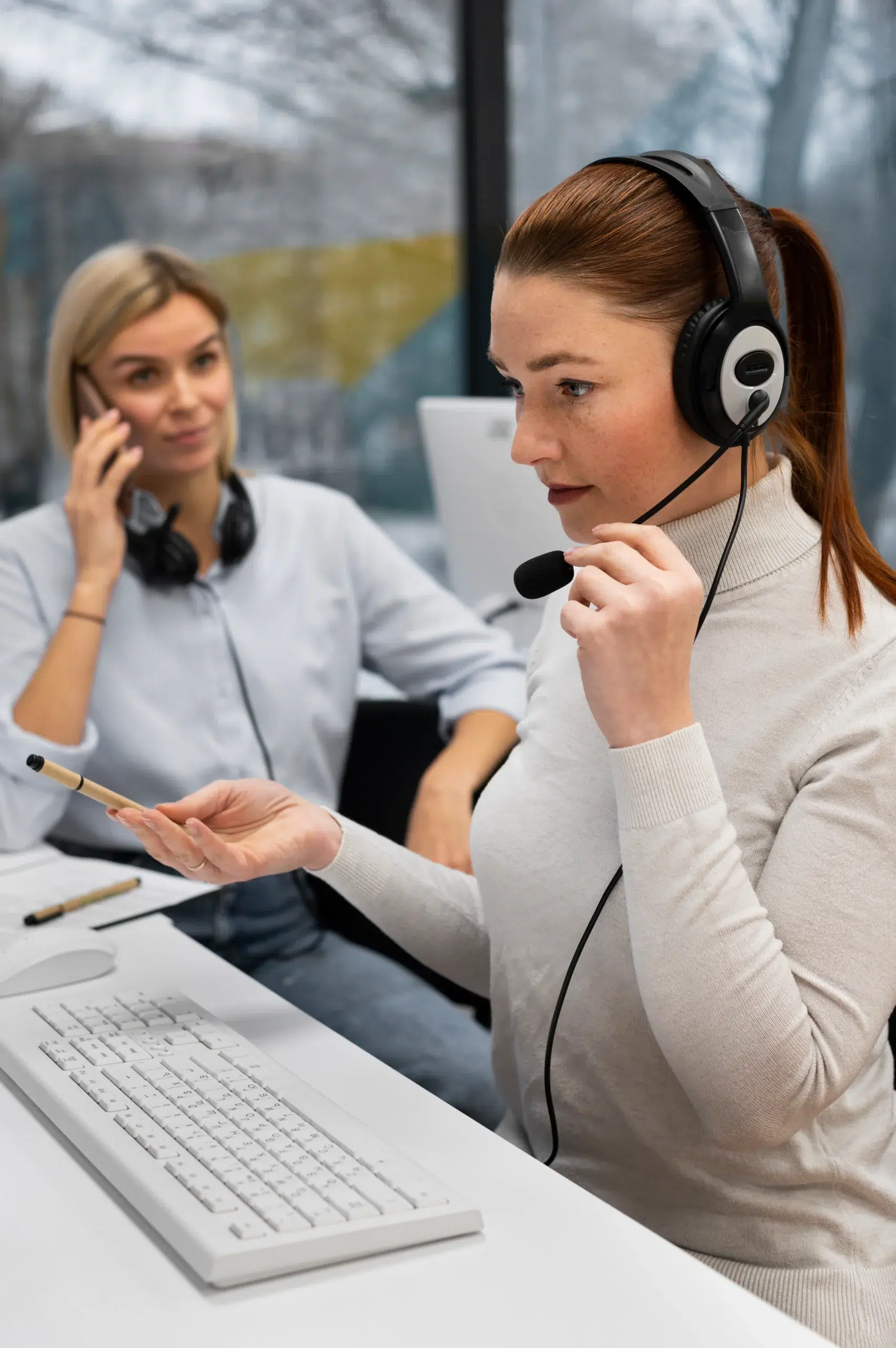 A female employee providing online support by using headset and mic